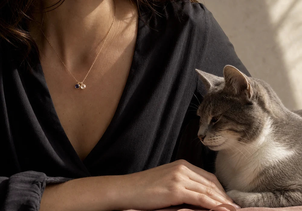 Close relationship moment between a cat and owner with symbolic jewelry