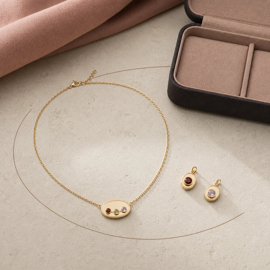 Gold-tone Miorava jewelry finish and simulated month stone detail