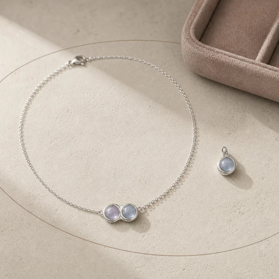 Silver-tone Bond Charm and simulated month stone detail